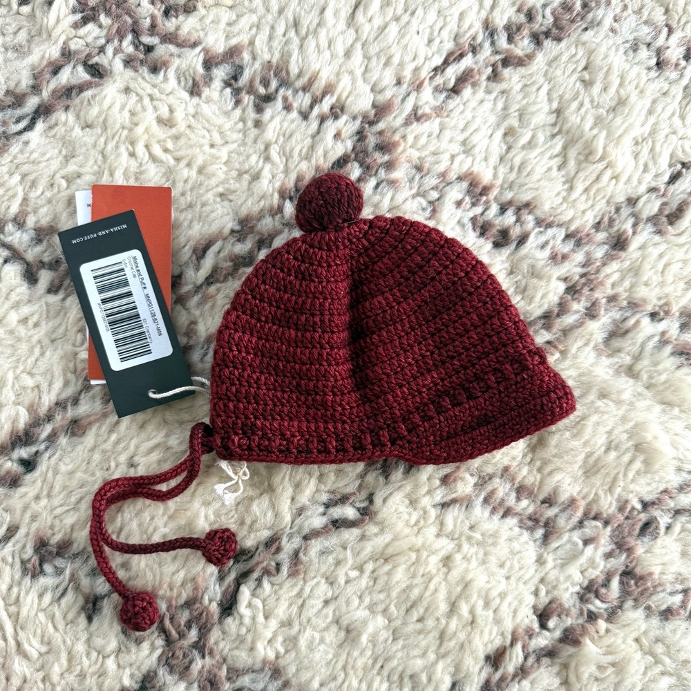 Misha and Puff Crochet Cap in Cranberry